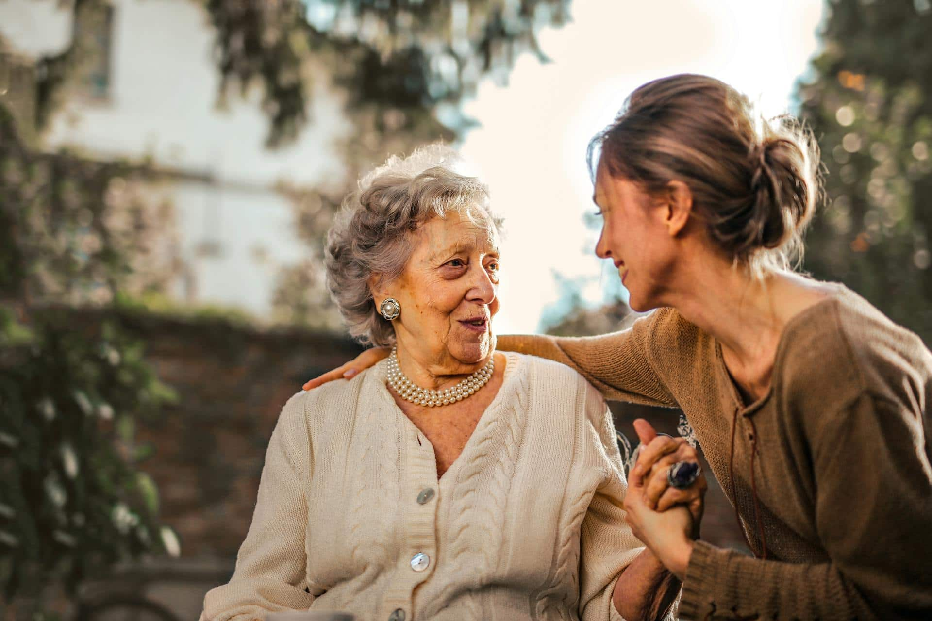 Woman talking to elderly mother